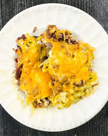 white plate with a serving of keto squash and ground beef casserole